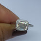 Bezel Setting East West Emerald Cut Solitaire Ring